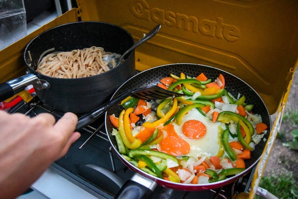 Cooking on a camp stove while backcountry camping