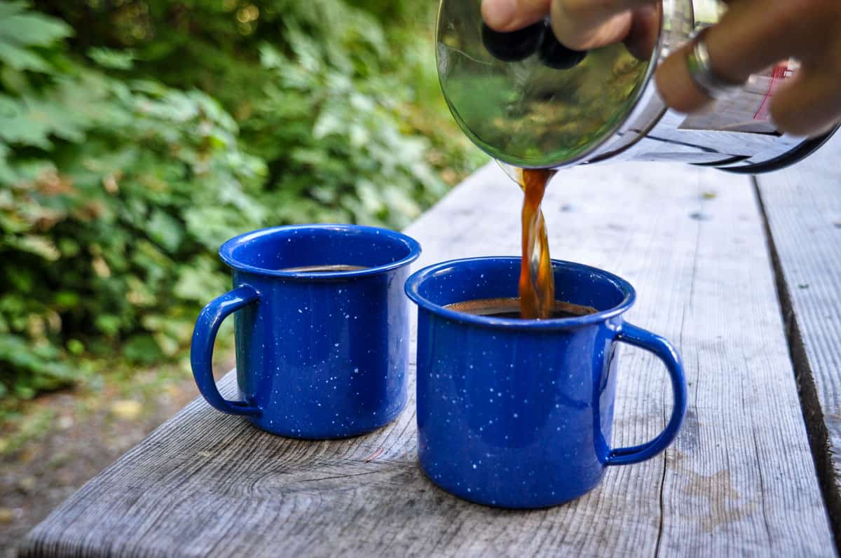 Process of making camping coffee outdoor Stock Photo by bondarillia