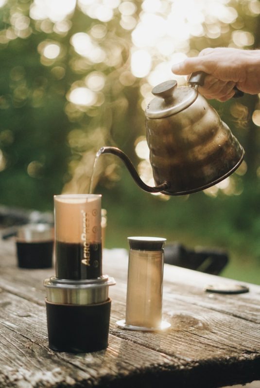Process of making camping coffee outdoor Stock Photo by bondarillia